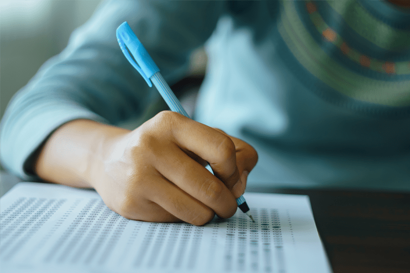 Close up of a student filling in answers to a standardized test