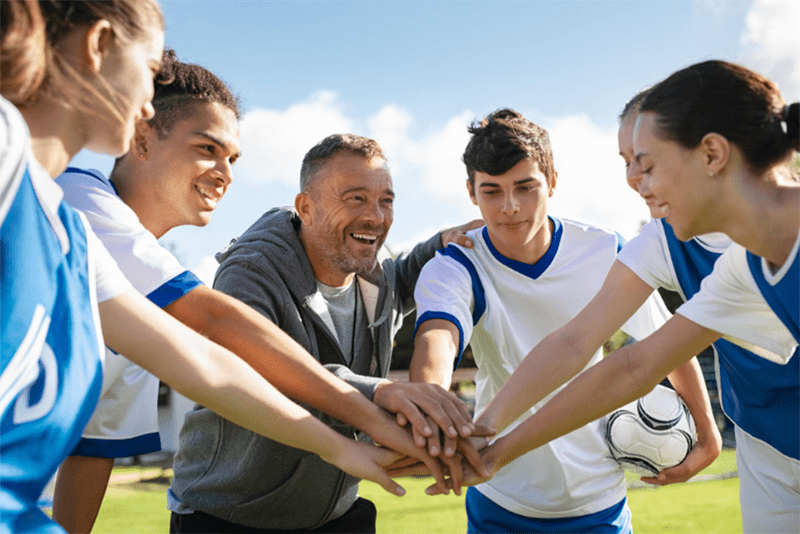 Soccer team huddle