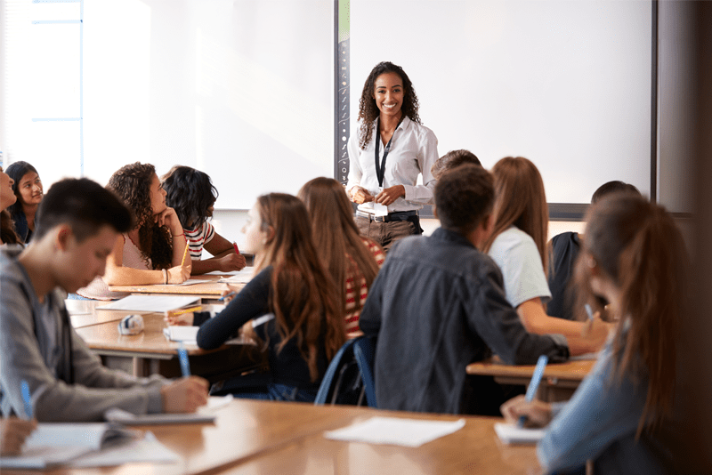 Teacher and high school students in a classroom