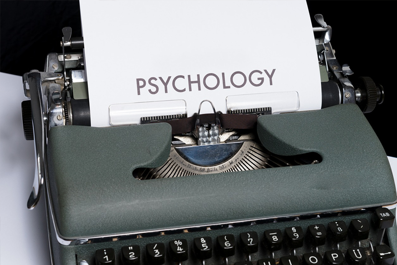 Typewriter and piece of paper with 'Psychology' written on it