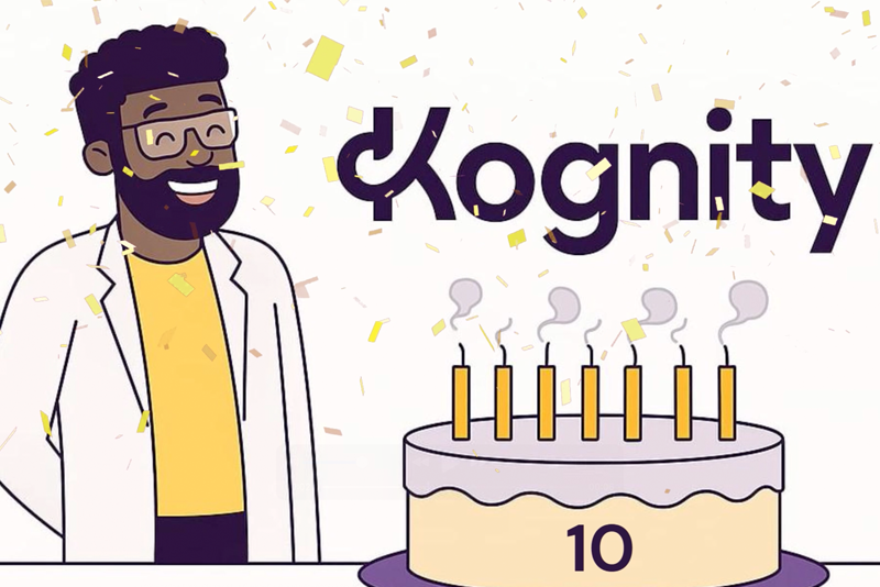 Science teacher blowing out candles on a Kognity 10-year birthday cake